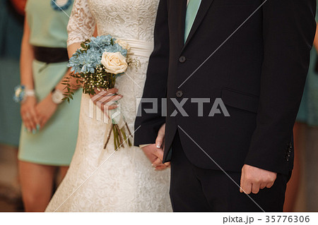 Beautiful wedding couple, bride and groom holding 35776306