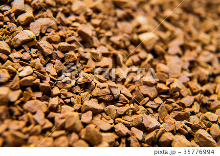 Pile of instant coffee grains background close up Pile of instant coffee grains background close up 35776994
