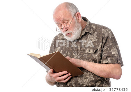 Senior man with glasses reading a book 35778436