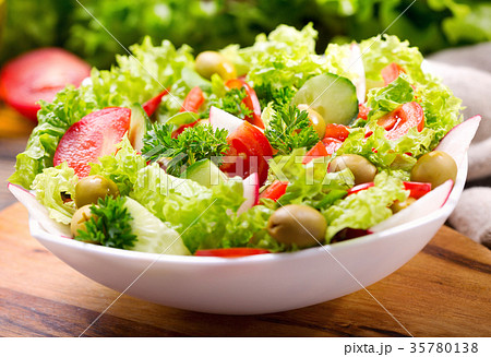 bowl of fresh salad with vegetables and greens bowl of fresh salad with vegetables and greens 35780138