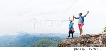 Tourist Couple With Backpack Holding Hands Raised 35789026