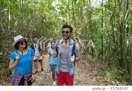 People Group With Backpacks Trekking On Forest People Group With Backpacks Trekking On Forest 35789207