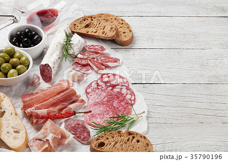 Salami, ham, sausage, prosciutto and wine 35790196
