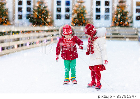 Kids ice skating in winter. Ice skates for child. 35791547