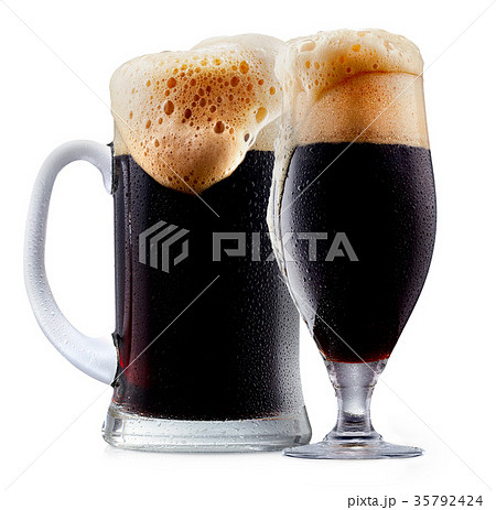 Mug of frosty dark beer with foam Mug of frosty dark beer with foam 35792424