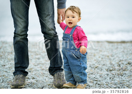 Baby girl and her father on the beach Baby girl and her father on the beach 35792816