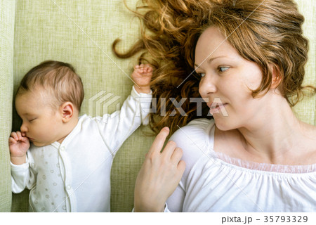 Beautiful woman and her newborn daughter Beautiful woman and her newborn daughter 35793329