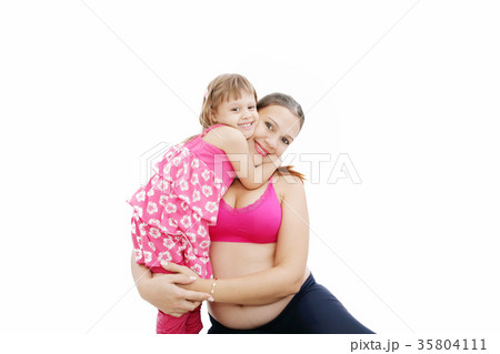 Beautiful pregnant woman with her daughter. 35804111
