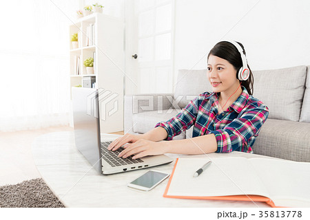 female university student typing mobile computer 35813778