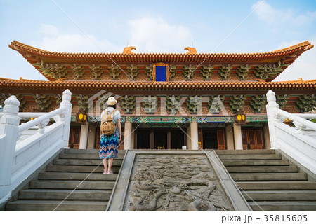 rear view of woman looking at traditional temple rear view of woman looking at traditional temple 35815605