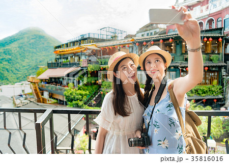 girls taking selfie of famous landmarks 35816016