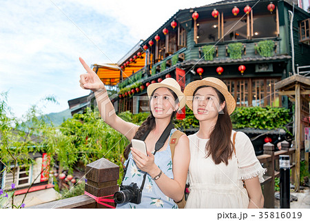 beautiful woman using online guidebook 35816019