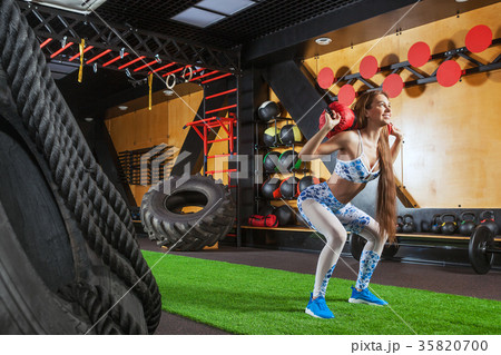 woman doing exercises in the gym woman doing exercises in the gym 35820700