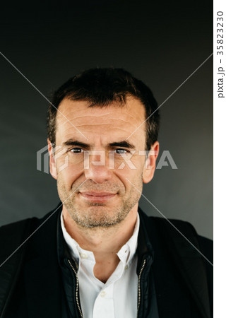 Portrait of middle-aged unshaved man smiling Portrait of middle-aged unshaved man smiling 35823230