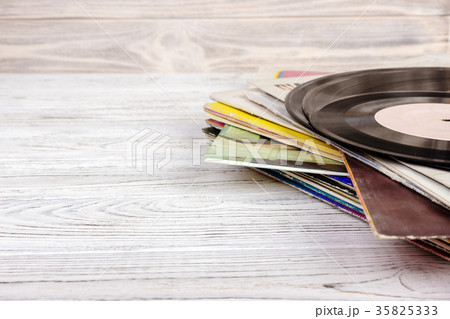 old vinyl record on the wooden table 35825333