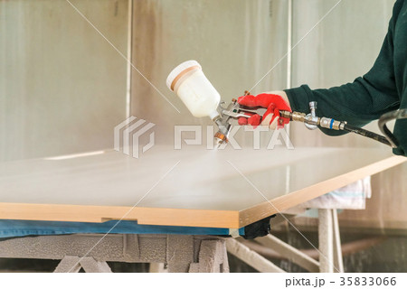 Staining wood with spray gun 35833066