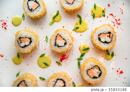 Sushi rolls scattered on white background 35833196