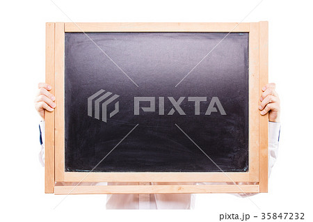 Boy holding blackboard isolated on white backdrop 35847232