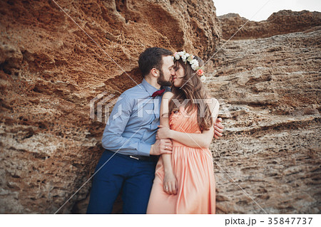 Romantic loving couple walking on the beach with Romantic loving couple walking on the beach with 35847737