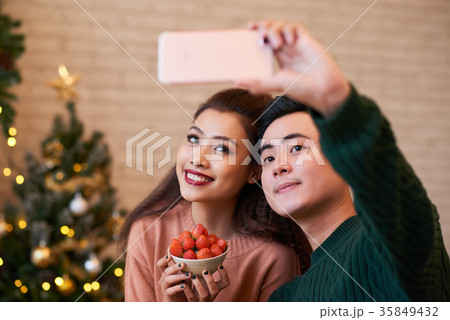 Couple taking selfie 35849432