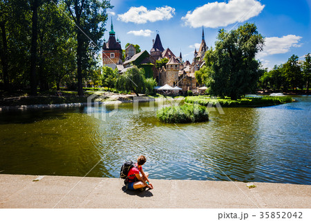 girl tourist sits overlooking the castle medieval 35852042