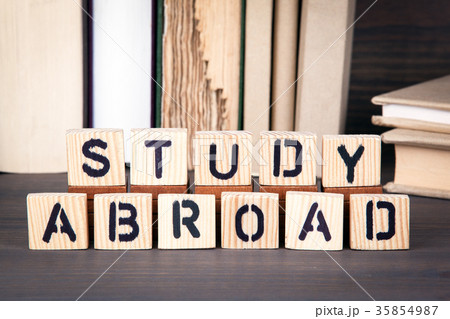 study abroad, wooden letters on wooden table. Education, success and communication background study abroad, wooden letters on wooden table. Education, success and communication background 35854987
