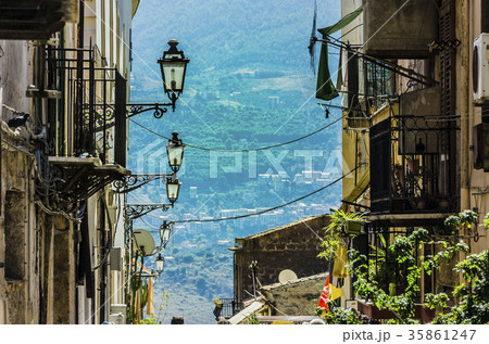 Building and street lamps of the town of monreale 35861247