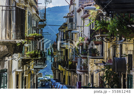 street with balconies and slope of monreale city 35861248