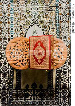 Koran - holy book of Muslims on the carpet Koran - holy book of Muslims on the carpet 35867097