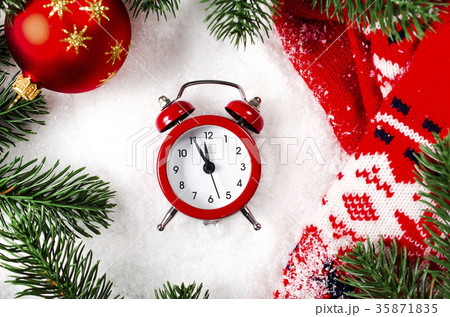 Christmas background with clock and scarf on snow. 35871835