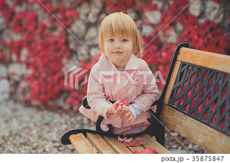 Baby cute girl with blond hair and pink apple chee Baby cute girl with blond hair and pink apple chee 35875847