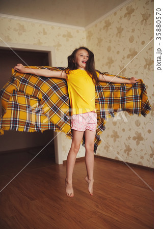 little girl with plaid at home 35880570