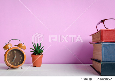 Books and glasses on a white wooden table Books and glasses on a white wooden table 35889052