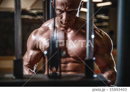 Handsome model young man posing in gym 35893403