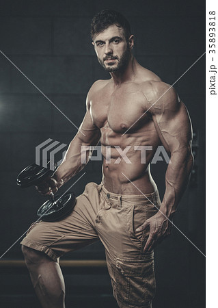 Attractive model young man training in gym 35893818