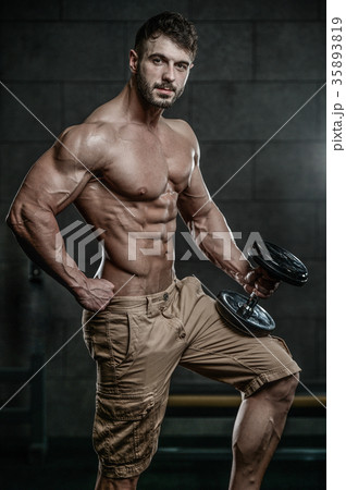 Attractive model young man training in gym Attractive model young man training in gym 35893819