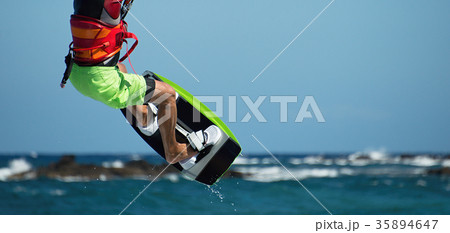 Kite surfer flying over the wave Kite surfer flying over the wave 35894647