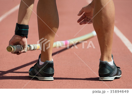 Pole vaulter prepares for jump Pole vaulter prepares for jump 35894649