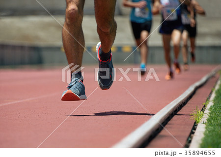 Athletics people running on the track field Athletics people running on the track field 35894655