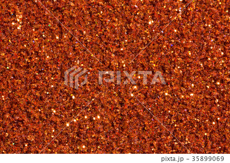Saturated brick-colour background with glitter. 35899069