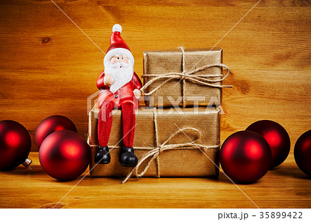 Christmas decorations on a wooden table with santa 35899422