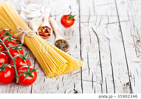 uncooked pasta with tomatoes and spices uncooked pasta with tomatoes and spices 35902346