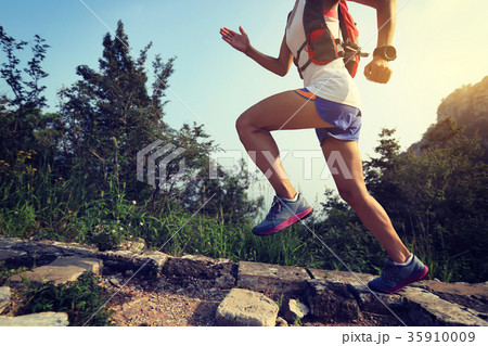 fitness woman trail runner running at great wall 35910009
