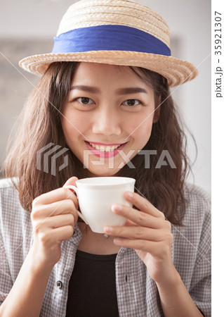 portrait head shot of beautiful younger asian woman and hot coff portrait head shot of beautiful younger asian woman and hot coff 35921307