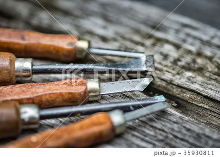 Old used wood chisel selection on the wooden table Old used wood chisel selection on the wooden table 35930811