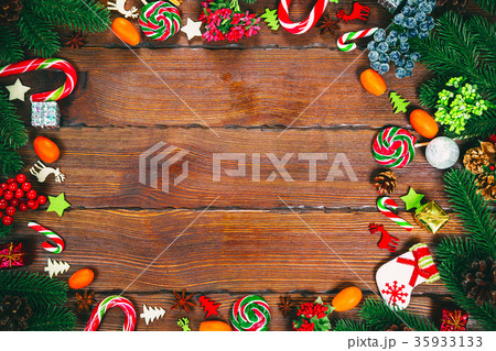 Christmas frame with Christmas tree branches Christmas frame with Christmas tree branches 35933133