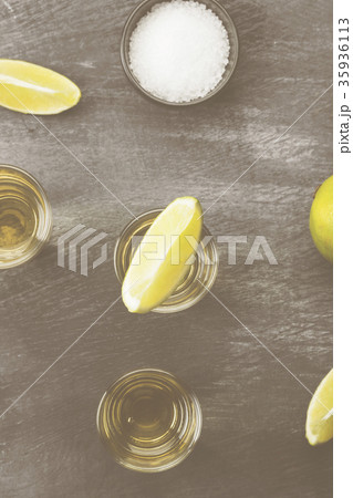 Tequila with lime and salt on a dark background 35936113