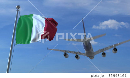 Commercial airplane landing behind waving Italian Commercial airplane landing behind waving Italian 35943161