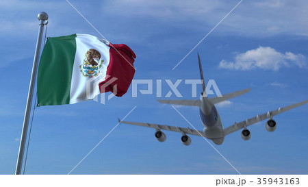 Commercial airplane landing behind waving Mexican 35943163