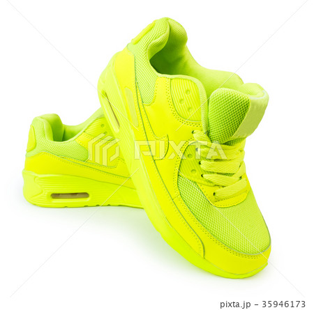 light green sneakers isolated white background 35946173